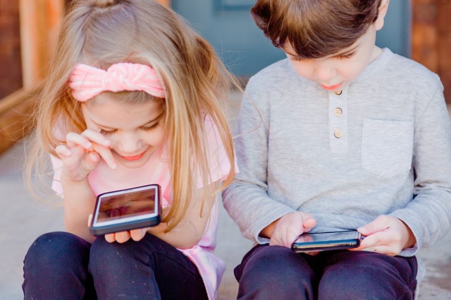 Children playing on phones